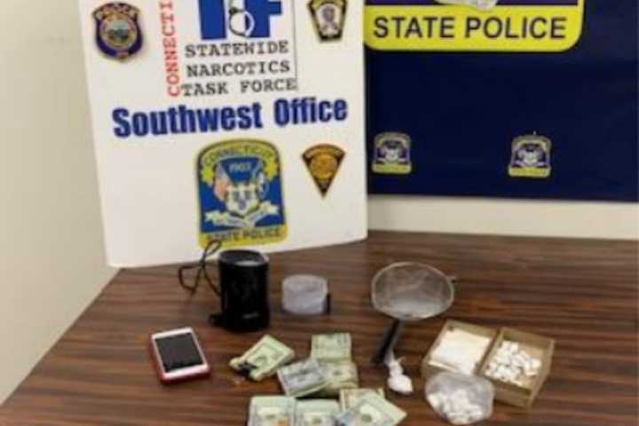 Firearm, Drugs, Cash Confiscated In Bust