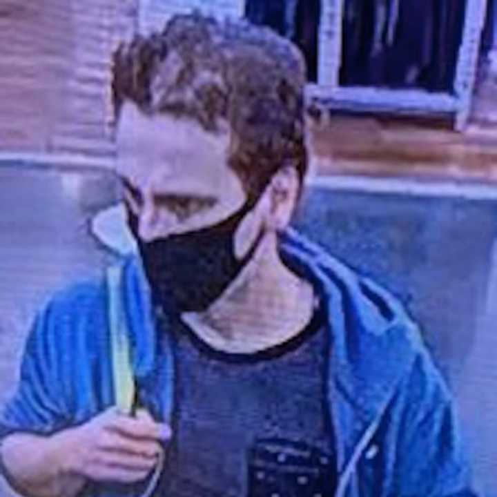 A surveillance image of the wanted man