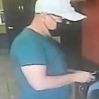 <p>Surveillance footage of the wanted man</p>