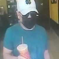 <p>Surveillance footage of the wanted man</p>