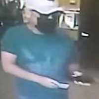 <p>Surveillance footage of the wanted man</p>