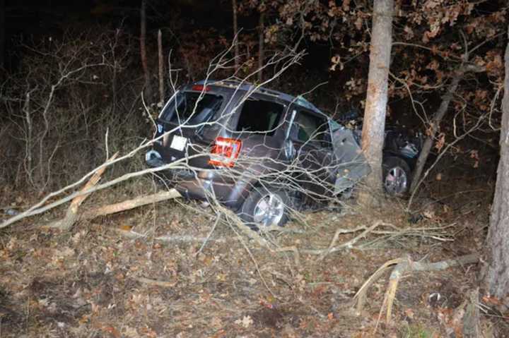 A 60-year-old Brick woman died when her car went off the road and hit a utility pole in Manchester Township Thursday, authorities said.