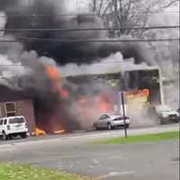 <p>Smoke billows out of Stoms ABS Automotive in Middlesex (Photo Courtesy Lincoln Hose Co. 1)</p>