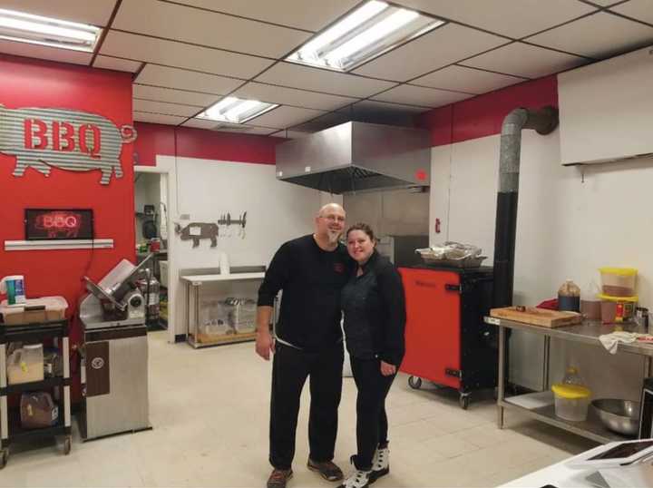 Alicia and Desi Dutcher togther in the kitchen of Legal Swine BBQ