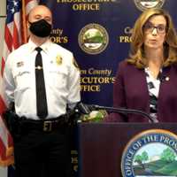 <p>Acting Camden County Prosecutor Jill S. Mayer, center, and Somerdale Police Chief James Walsh, left, during a news conference on Friday&#x27;s arrest in a 21-year-old rape, robbery and attempted murder case. A photo of the 47-year-old suspect is at right.</p>