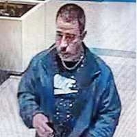 <p>A surveillance image of the wanted man</p>