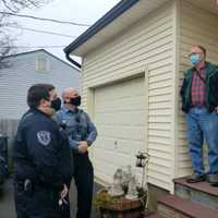 <p>Brick Police Officer Daniel Fogarty and EMT Brian Schwarz reunited with the Hollers on their front porch on Saturday for a brief, COVID-safe meet and greet where Joe Holler thanked two of the First Responders who saved his life on Halloween.</p>