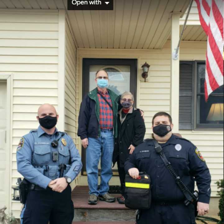 Joe Holler and his wife, on their porch, thanked Brick Police Officer Daniel Fogarty and EMT Brian Schwarz for helping save him from a fatal heart attack on Halloween.  Brick Township EMT Joseph Sharkey was unable to make it to Saturday&#x27;s reunion.