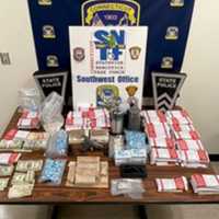 <p>Some of the drugs and cash seized.</p>