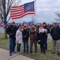 <p>Wrigley can be seen holding the flag wearing the same clothes depicted in a selfie he posted inside the U.S. Capitol building, federal officials said.</p>