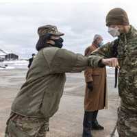 <p>U.S. Army Col. Lisa J. Hou, state Adjutant General and Commissioner of the New Jersey Department of Military and Veterans Affairs, greets Airmen during the return of 108th Wing and 177th Fighter Wing members to New Jersey on Wednesday.</p>