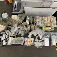 <p>Drugs and cash seized.</p>