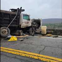 <p>The truck hanging off the wall.</p>