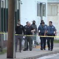 <p>Detectives investigate a fatal shooting about a block from the police station in Paulsboro. (Courtesy: 6ABC-TV News)</p>