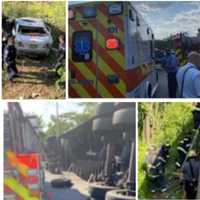 <p>Newark firefighters rescue a driver whose car fell down an embankment Tuesday.</p>