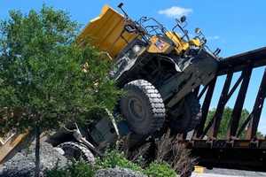 PHOTOS: Driver Trapped; Dump Truck, Train Engine Severely Damaged In Head-On Crash In Nazareth