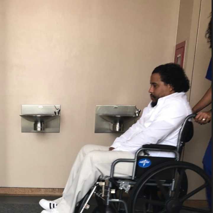 Fernando Ramirez Jr. arriving in court in a wheelchair.