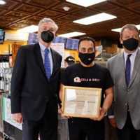 <p>White Plains Mayor Thomas Roach, Westchester County Executive George Latimer, and Bagels &amp; Deli Express owner Anthony Barona at the grand opening of the new shop.</p>