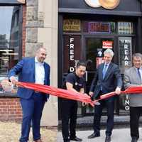 <p>White Plains Mayor Thomas Roach, Westchester County Executive George Latimer, and Bagels &amp; Deli Express owner Anthony Barona at the grand opening of the new shop.</p>