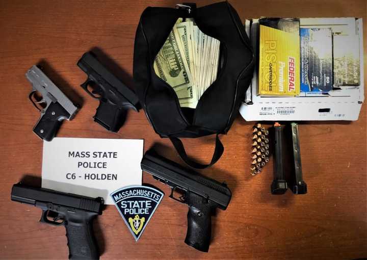 A wanted man was arrested with multiple illegal weapons.