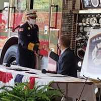 <p>Hamilton Township Fire Chief Rich. Kraemer greets Mayor Jeff Martin at an October 2020 marking the dissolution of the township’s nine fire districts into one fire division effective Jan. 1 of this year. (Photo Courtesy of Community News Service.)</p>