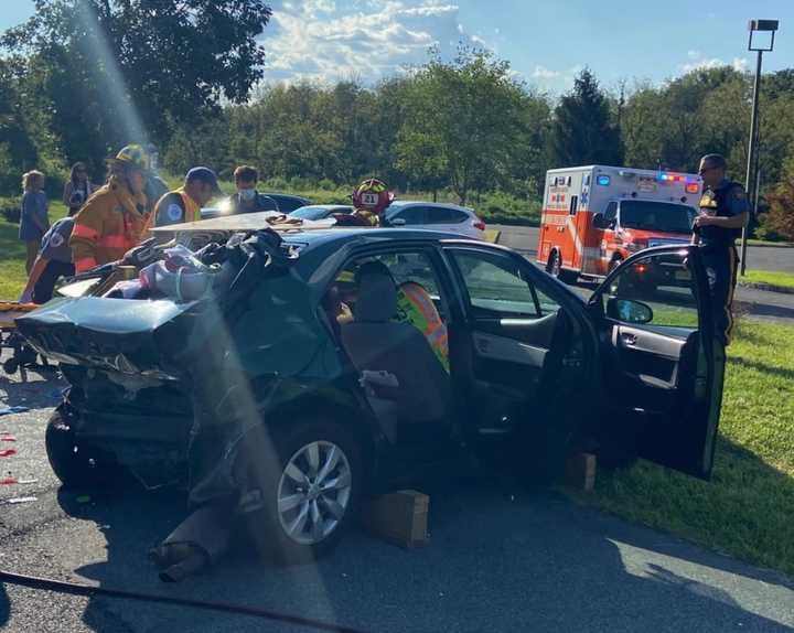 A trapped driver was freed and hospitalized following a three-car crash on Route 202 in Hunterdon County, authorities said.