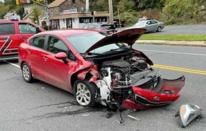 Two cars collided at a busy intersection in Lambertville Wednesday morning, authorities said.