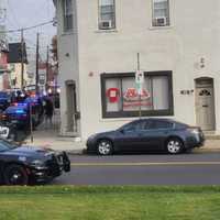 <p>Officers in police vests and carrying rifles converged on the Humbert Street home off Park Avenue shortly after 9 a.m.</p>