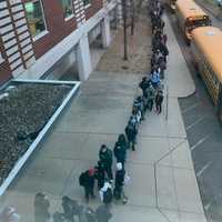 <p>Students waiting to get inside the high school in Hamden.</p>