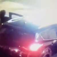 <p>The video shows the suspect fleeing in a vehicle appearing to be an SUV or minivan.</p>