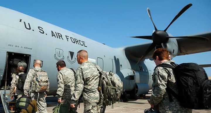 US Airmen board a U.S. Air Force C-130 Hercules (STOCK PHOTO).