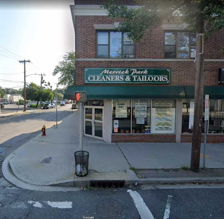 The bus struck the dry cleaner on the corner of Merrick Road and Benson Lane.