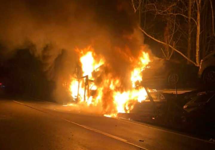 Four vehicles were destroyed as a car carrier went up in flames on Route 80, authorities said.