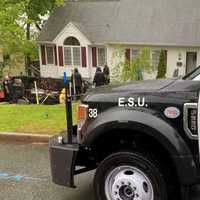 <p>Car flips down driveway on Gordon</p>