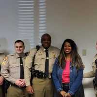 <p>Lt. Vincent Upole (far left) assisted in apprehending the mass shooting suspect.</p>