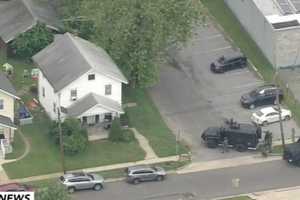 Fatal Shooting Suspect Surrenders In SWAT Standoff, School Locked Down