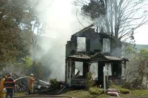 Woman Killed When Dump Truck Crashes Into Capital District Home, Starts Fire