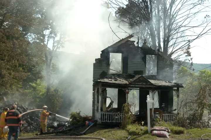 Woman Killed When Dump Truck Crashes Into Ashland Home, Starts Fire