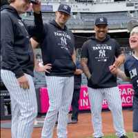 <p>The child enjoys a day with his Yankee heroes.</p>