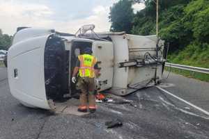 Overturned Garbage Truck Causes I-83 HazMat Situation