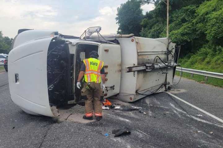 Overturned Garbage Truck Causes I-83 HazMat Situation