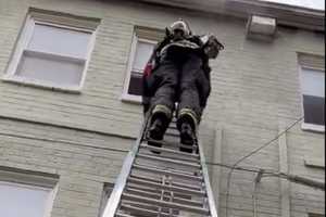 Video Shows Firefighters Rescuing Adult, Child Trapped In Burning DC Building