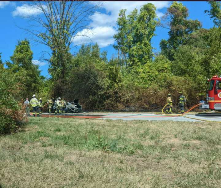 Firefighters put down the fire (left) Saturday, Aug. 27.