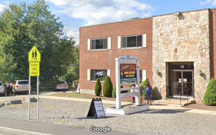 Investigators said three men ran a sophisticated online drug empire from this nondescript office building at 1749 Central St. in Stoughton.