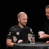 <p>David Blaine performs a card trick for Sean Evans using Carolina Reapers.</p>