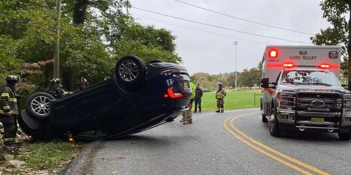 A driver escaped injury after a car slammed into a rock wall and flipped completely over, landing on its roof during a crash in Morris County, authorities said.