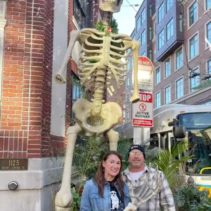 Maria Bennes and her husband gave Wusong Road a new arm for the Harvard Square tiki bar&#x27;s 12-feet-tall Halloween skeleton after someone stole the appendage from the restaurant&#x27;s statue.