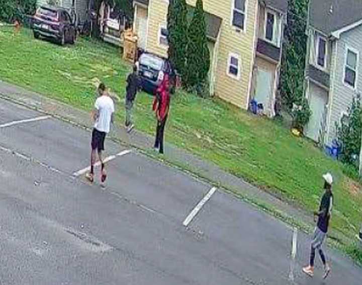 Prosecutors released this photo of four people seen leaving the area of a murder on July 5 in Salem City. They are believed to have witnessed a portion of what happened.