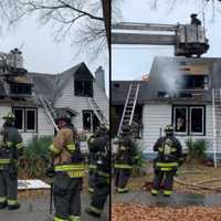 <p>Firefighters in the aftermath of the two-alarm fire on South Dakota Avenue NE.</p>