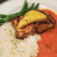 <p>Sweet &amp; Smokey Spiced Mahi Mahi with Calypso sauce, charred jalapeno-pineapple butter, jasmine rice &amp; fresh vegetables.</p>